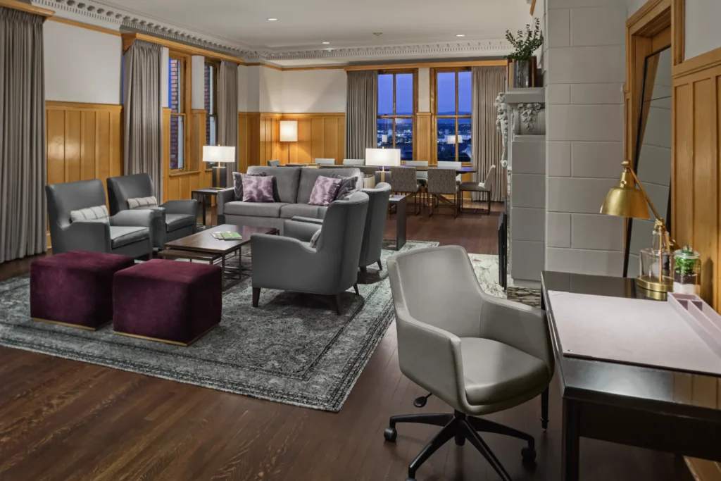 a living room filled with furniture and a large window