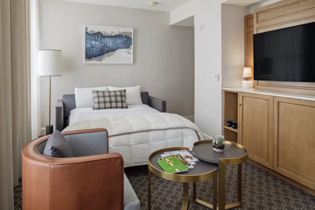 a hotel room with a bed and a couch