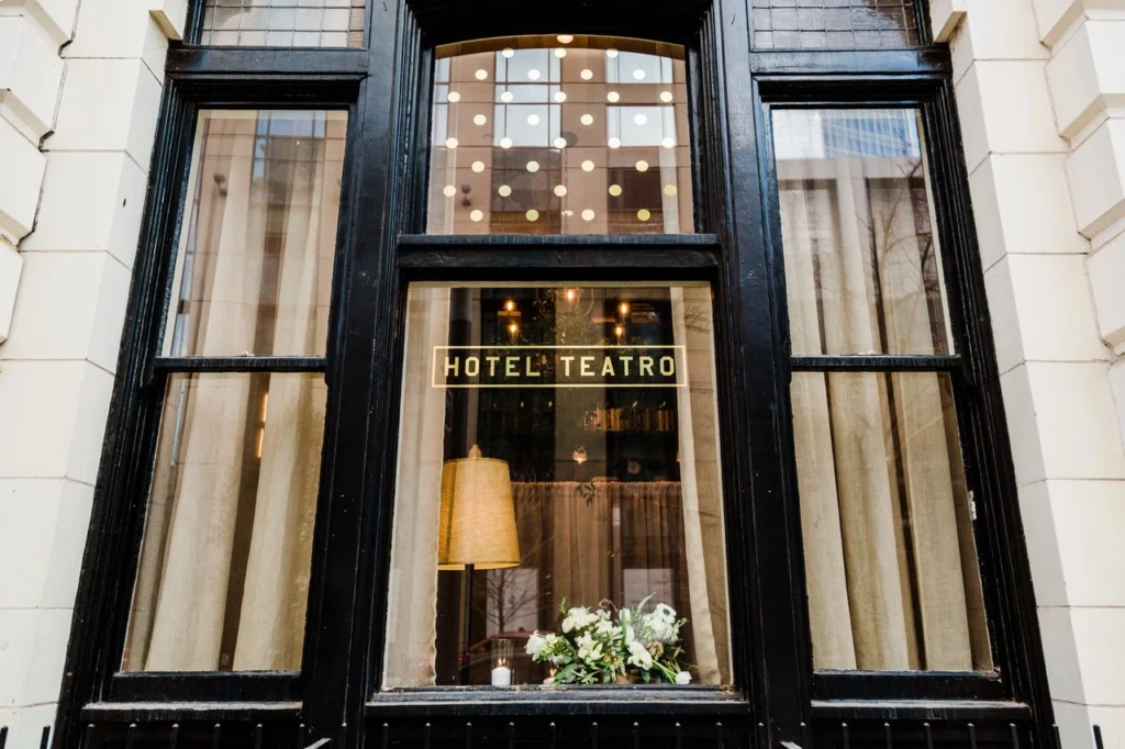 a hotel window with a hotel sign on it