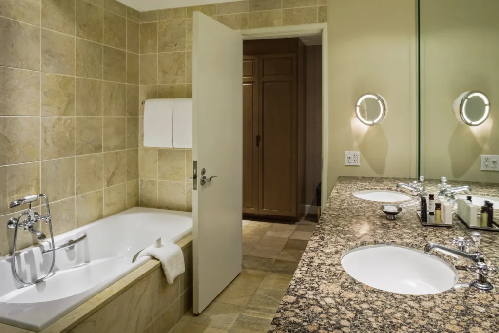 a bathroom with two sinks and a bathtub