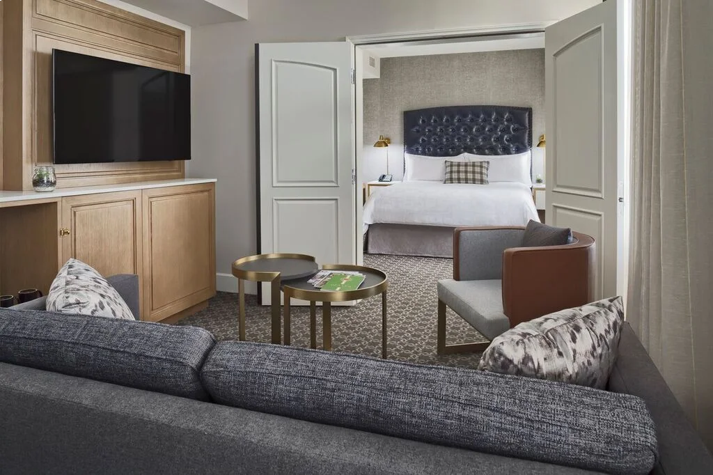 a living room with a couch a table and a tv