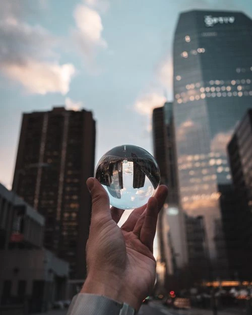 a person holding a crystal ball in their hand
