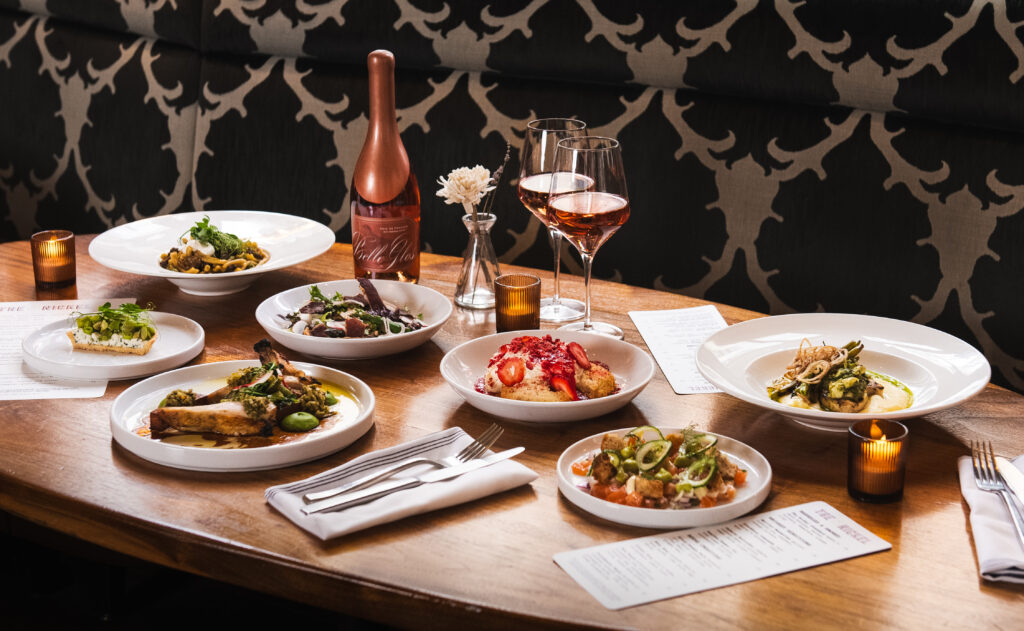 spring dishes and a bottle of wine on a table