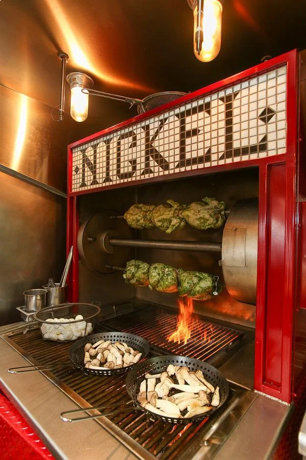 a bunch of food is cooking on a grill