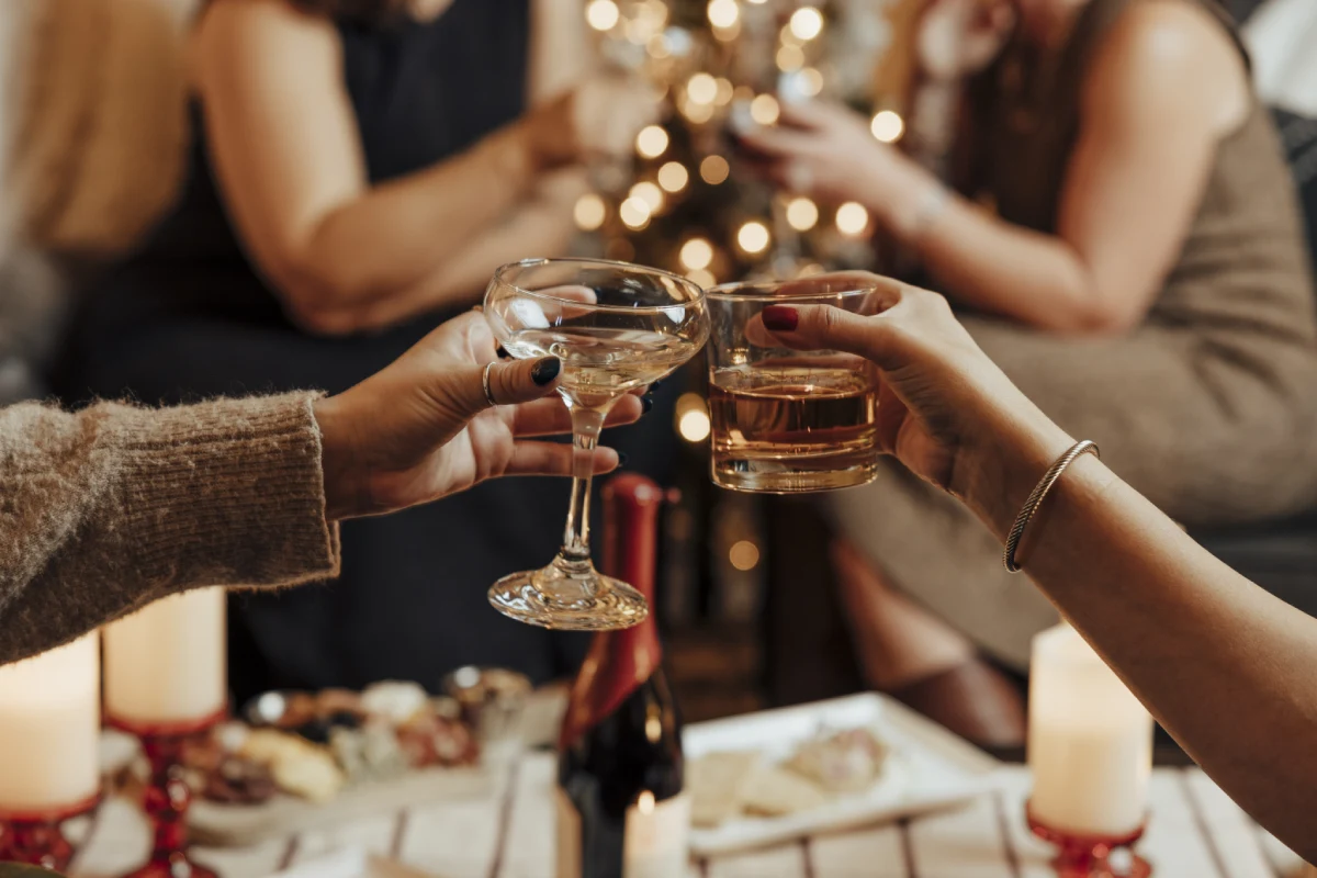 a group of people toasting with wine glasses