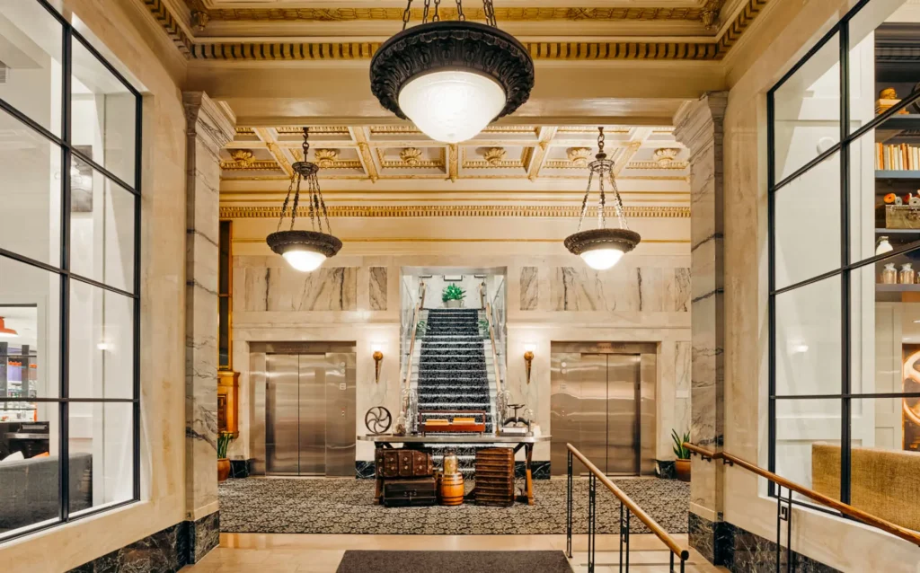 a lobby with a staircase and a set of stairs