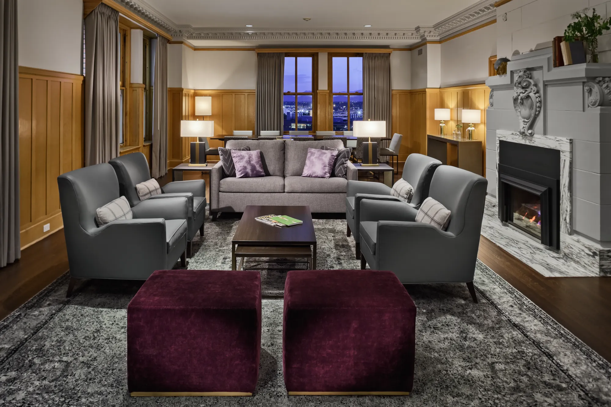 a living room filled with furniture and a fire place