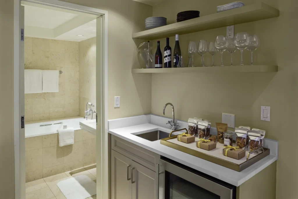 a kitchen with a sink and a wine rack
